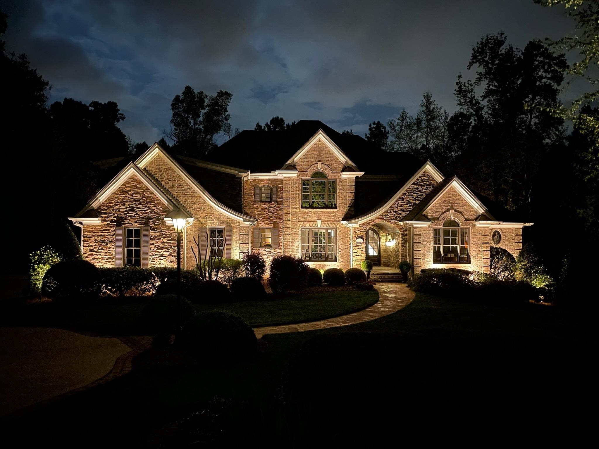 1129 Devlin Court Raleigh, NC 27614 - Photo 1 of 63 Updated to perfection by original owner; Private w/1st flr Owners retreat; Gourmet Kit w/island, banquette seating area, 6 gasrange w/stone hood, SS, btlr's pntry-Opens to Fam w/Stone FP; Multigenerational Liv;Updates Galore: New Roof & Skylights Night Photo