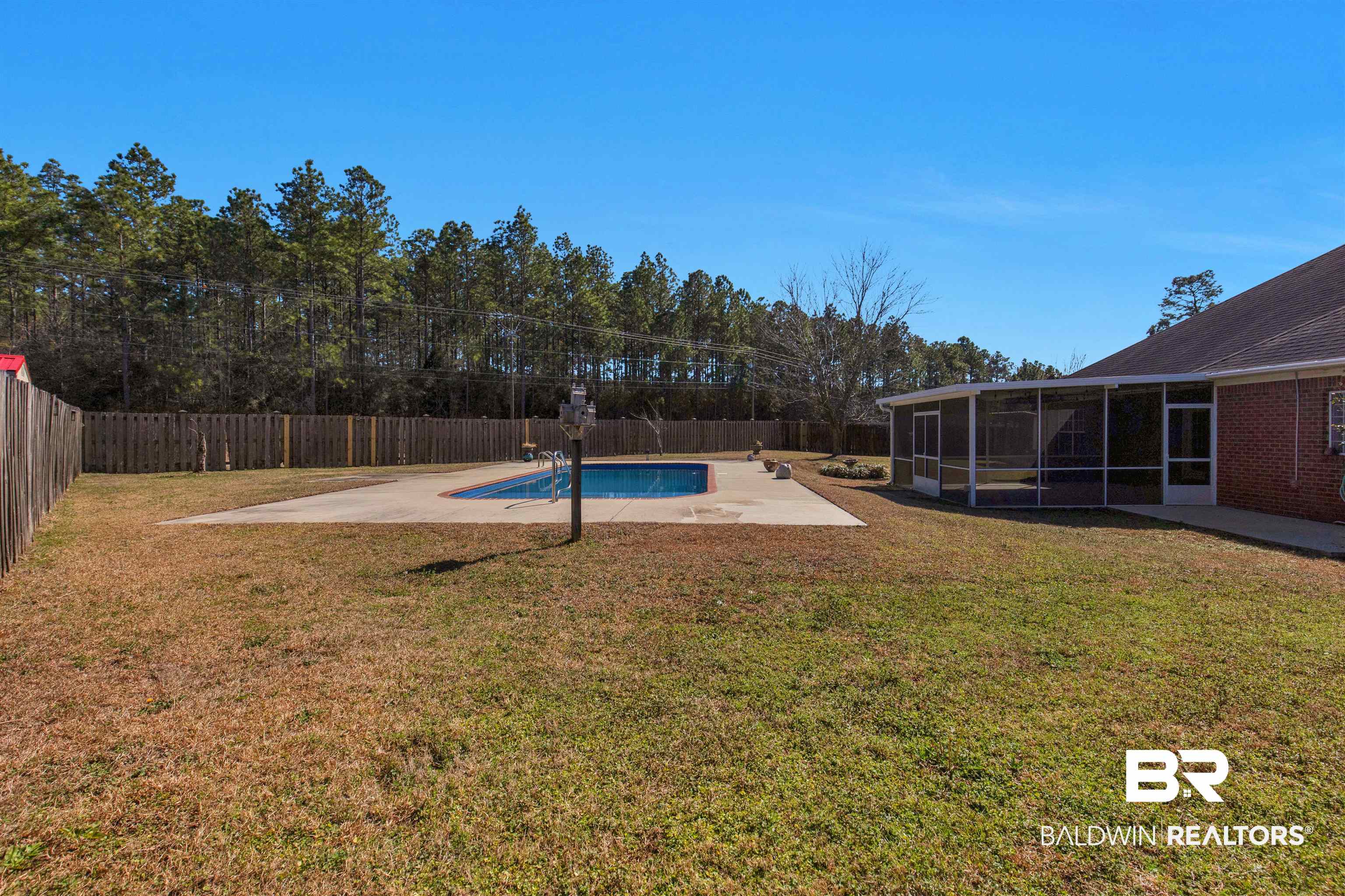 330 Allison Court Mobile, AL 36608 - Photo 24 of 27 View of pool with a lawn, a sunroom, and a patio