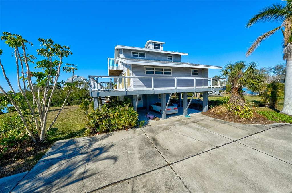 145 Burns Road Terra Ceia, FL 34250 - Photo 12 of 65 a view of a house with a patio