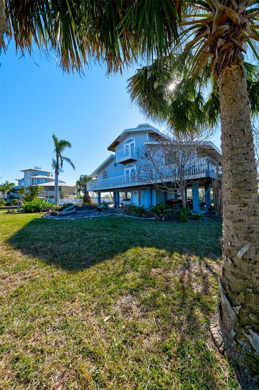145 Burns Road Terra Ceia, FL 34250 - Photo 21 of 65 a view of a house with a yard