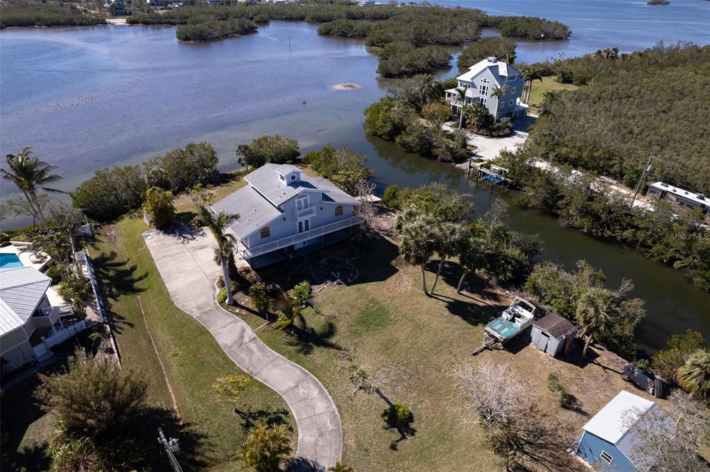 145 Burns Road Terra Ceia, FL 34250 - Photo 26 of 65 an aerial view of a house with a yard and lake view