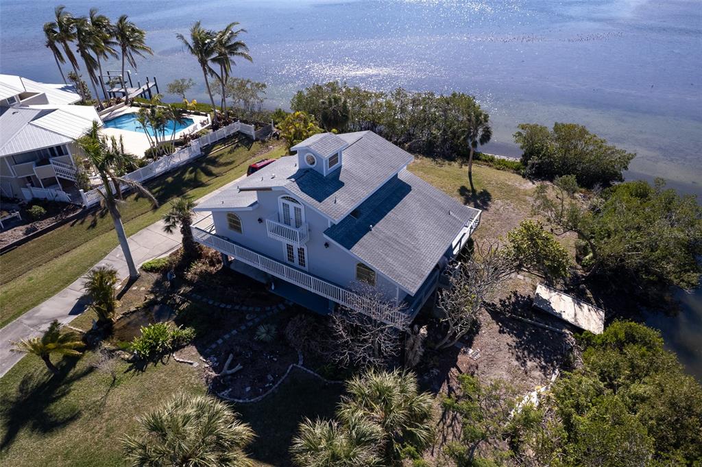 145 Burns Road Terra Ceia, FL 34250 - Photo 29 of 65 a view of a house with a yard