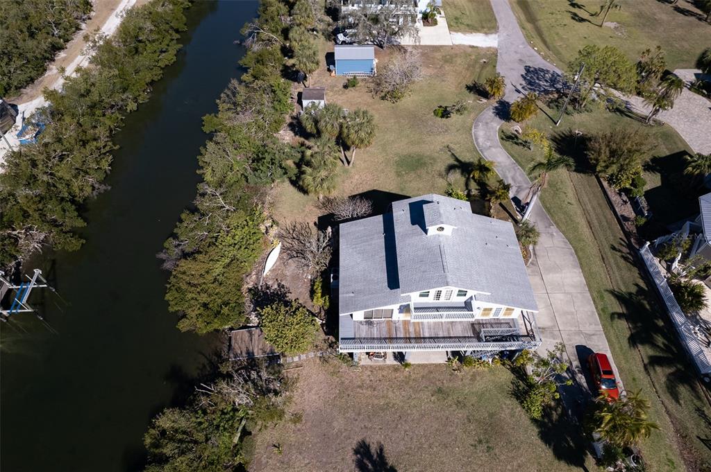 145 Burns Road Terra Ceia, FL 34250 - Photo 33 of 65 an aerial view of a house with a yard