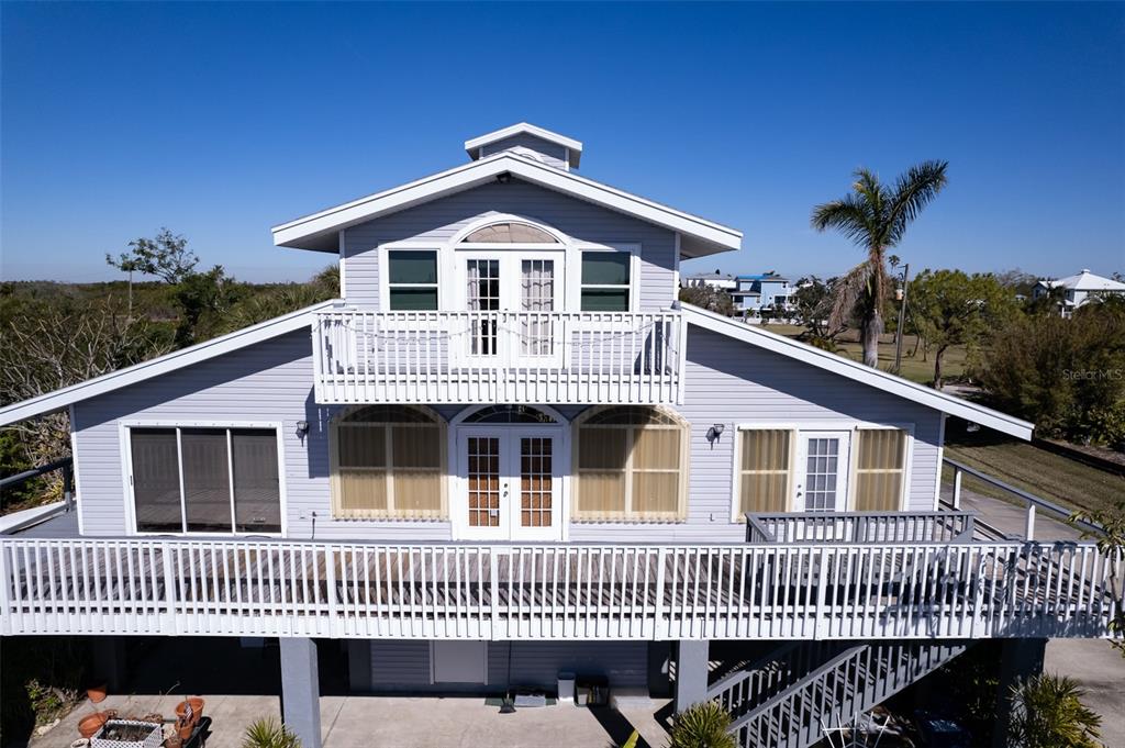 145 Burns Road Terra Ceia, FL 34250 - Photo 40 of 65 a front of a house with a deck