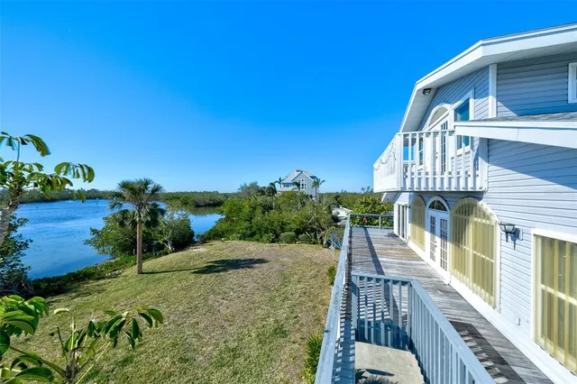 a view of a balcony with potted plants