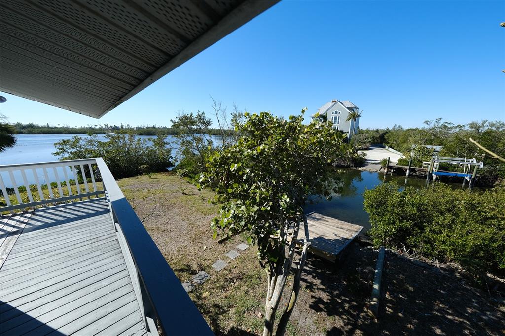 145 Burns Road Terra Ceia, FL 34250 - Photo 44 of 65 a view of a balcony with wooden floor and outdoor space