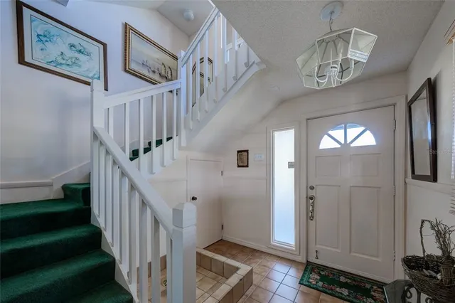 a view of a livingroom with furniture and hardwood floor
