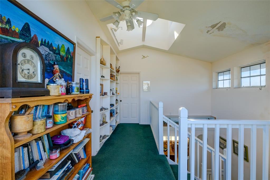 145 Burns Road Terra Ceia, FL 34250 - Photo 60 of 65 a bedroom with furniture a baby crib and a book shelf