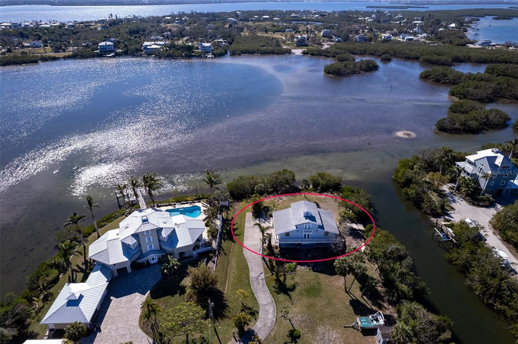 145 Burns Road Terra Ceia, FL 34250 - Photo 10 of 65 an aerial view of a house with a lake view