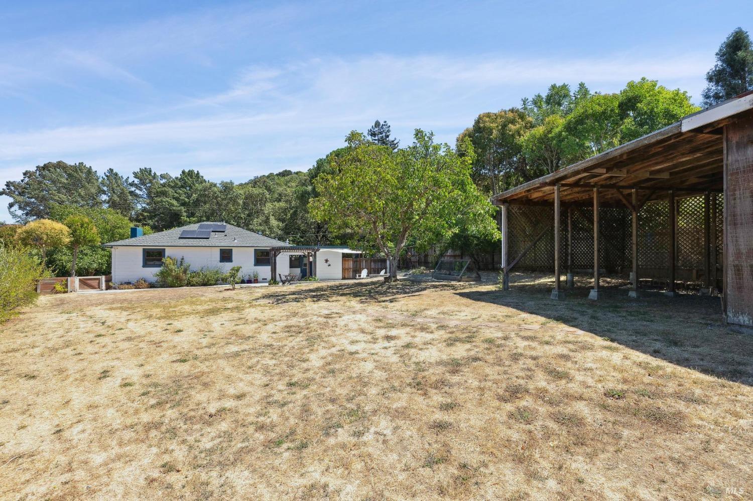 499 Ridge Road Novato, CA 94947 - Photo 1 of 1 a house with trees in the background