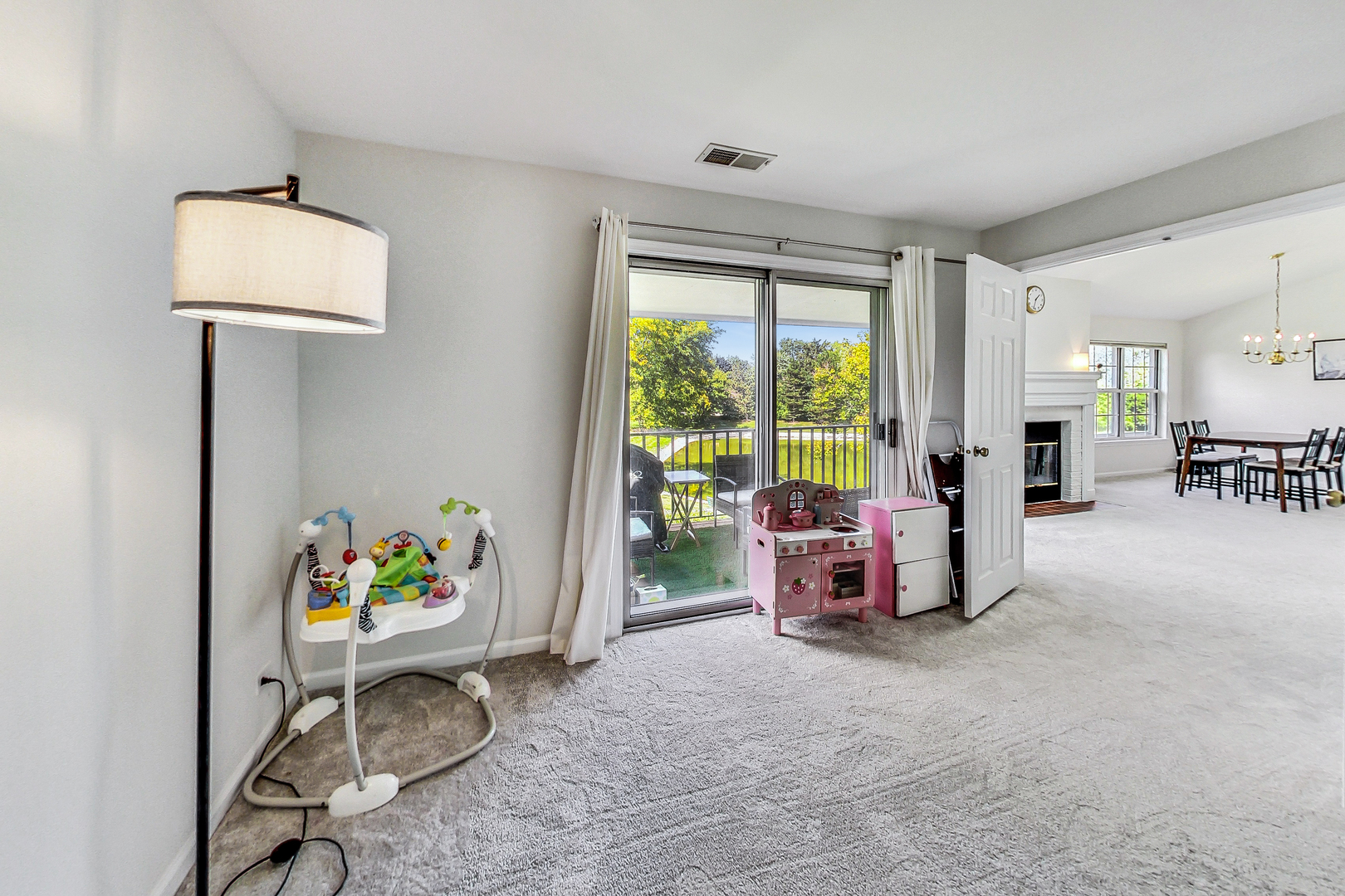 816 Butternut Lane, Unit C Mount Prospect, IL 60056 - Photo 14 of 32 a playing room with toys and a chandelier