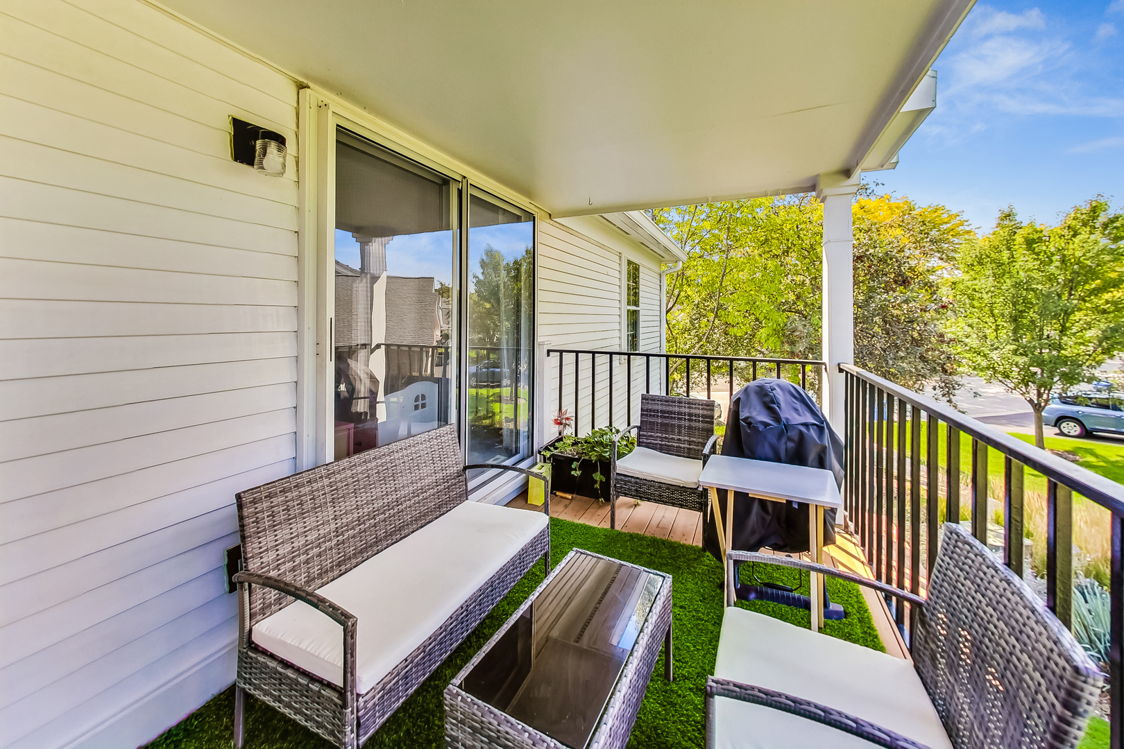 816 Butternut Lane, Unit C Mount Prospect, IL 60056 - Photo 23 of 32 a view of balcony with wooden floor and outdoor seating