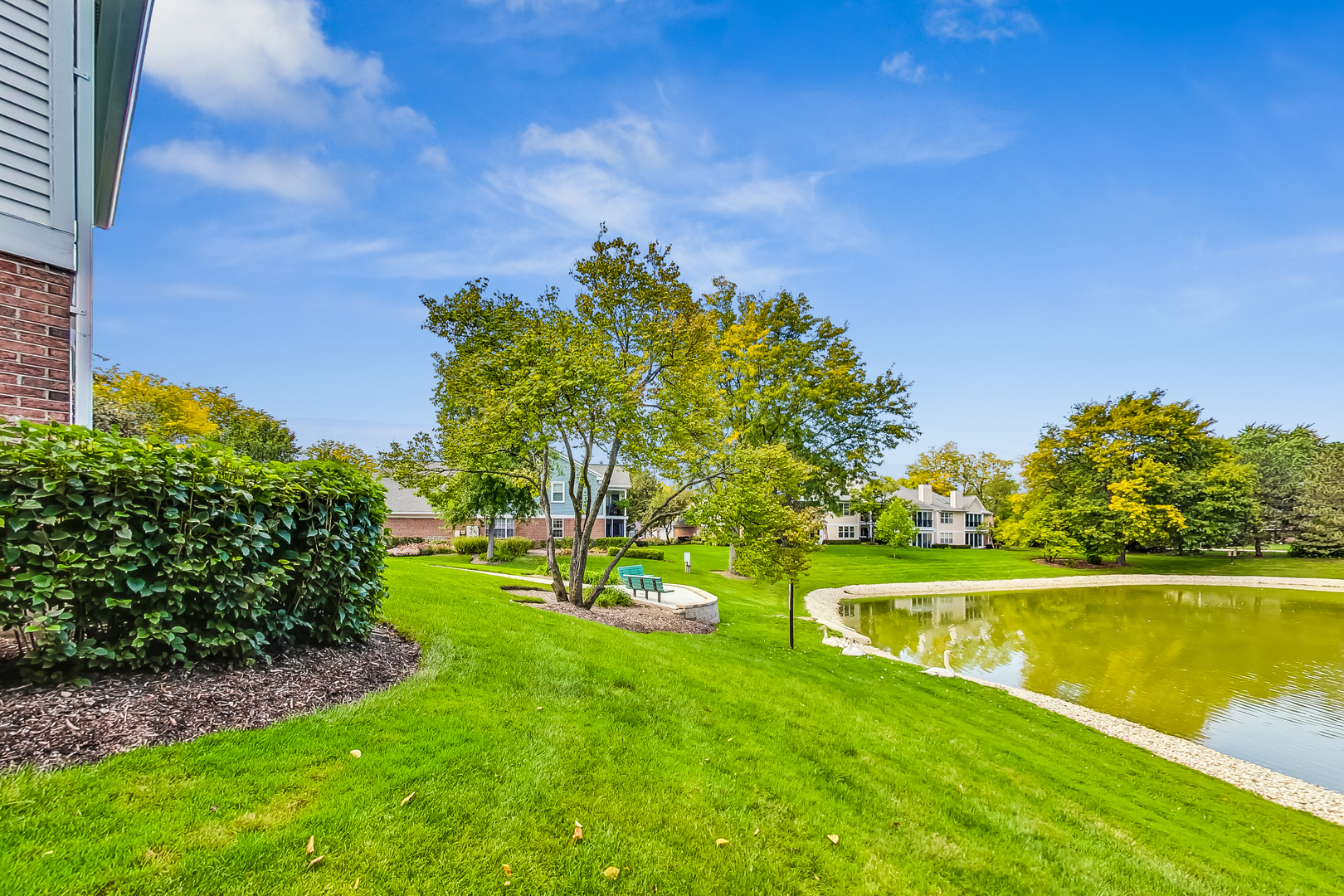 816 Butternut Lane, Unit C Mount Prospect, IL 60056 - Photo 27 of 32 a view of a swimming pool with a yard
