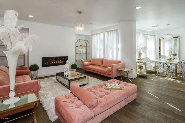 a living room with furniture and a table