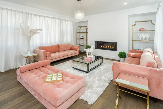 a living room with furniture rug and window