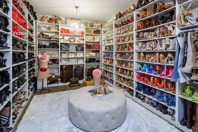 a view of walk in closet with clothes