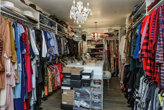 a spacious bedroom with a bed and a couch