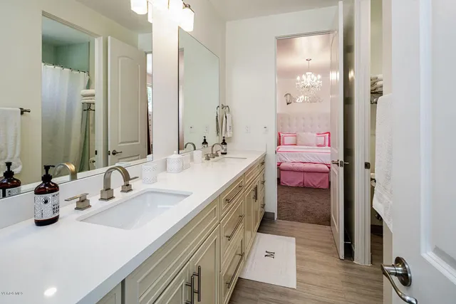 a bathroom with a sink toilet and a mirror