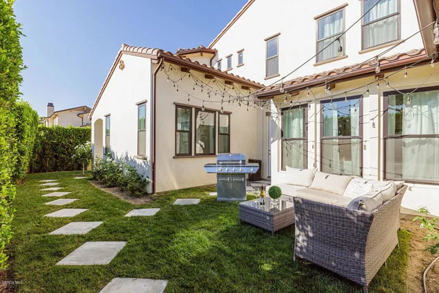 a view of backyard with patio