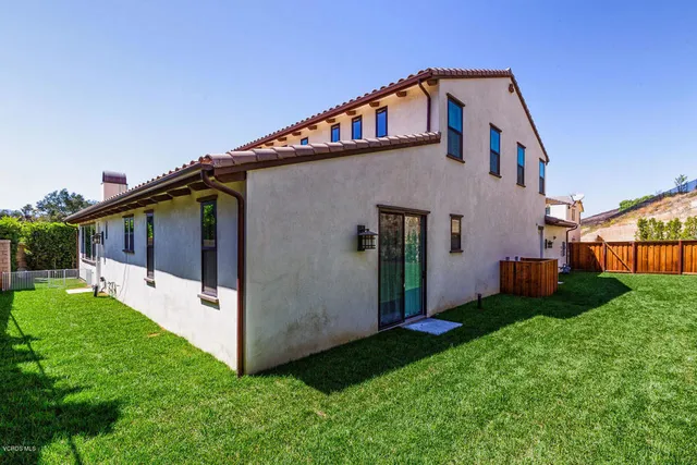 a bedroom with bed and window
