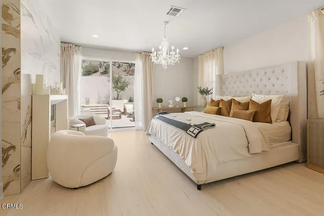 a bedroom with furniture and a large bed