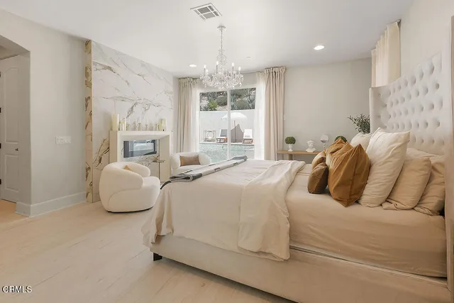 a spacious bathroom with a tub sink and mirror