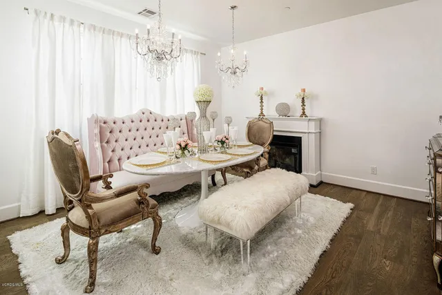 a dining room with furniture and window