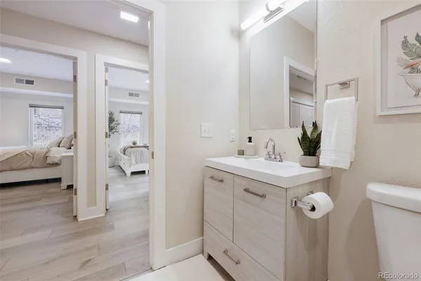 a en suite bathroom with a sink and mirror