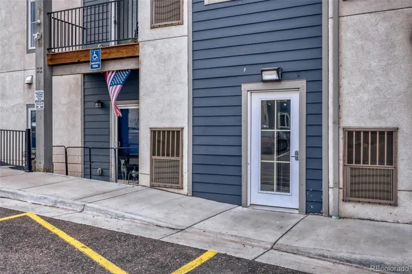 a view of a house with a door and a balcony