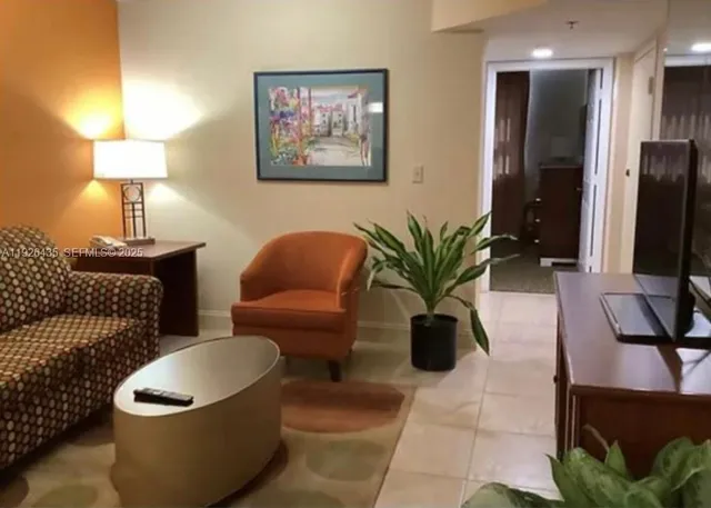 a picture of a living room and a couch