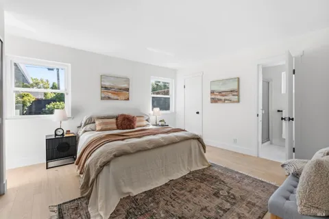a bed room with a bed and a window