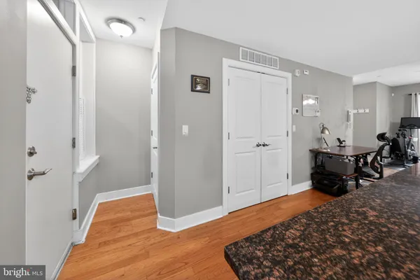 a bed room with a bed and mirror