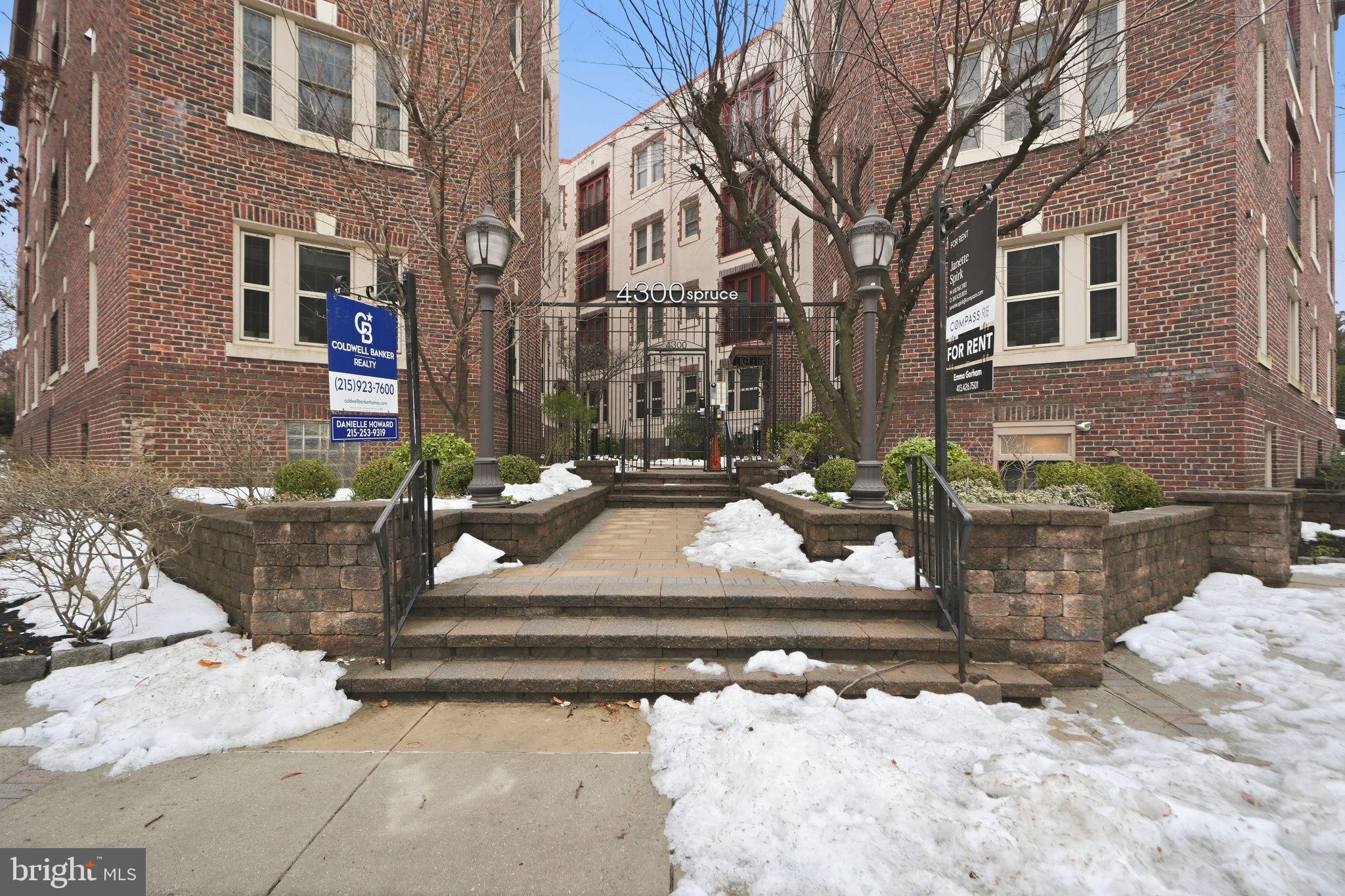 4300 Spruce Street, Unit B304 Philadelphia, PA 19104 - Photo 2 of 26 a front view of a building with cars parked
