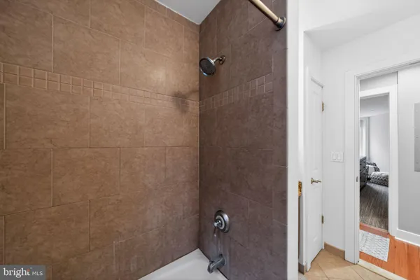 a bathroom with a glass door shower