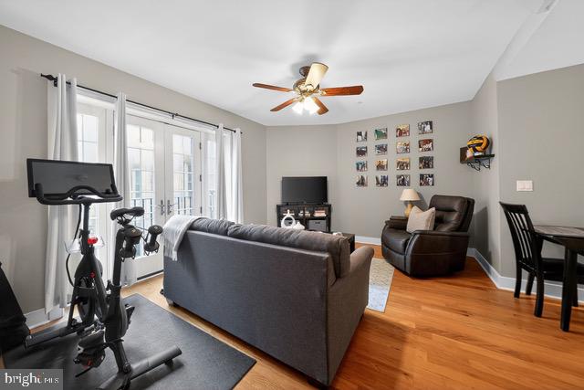 4300 Spruce Street, Unit B304 Philadelphia, PA 19104 - Photo 5 of 26 a living room with furniture a flat screen tv and a large window