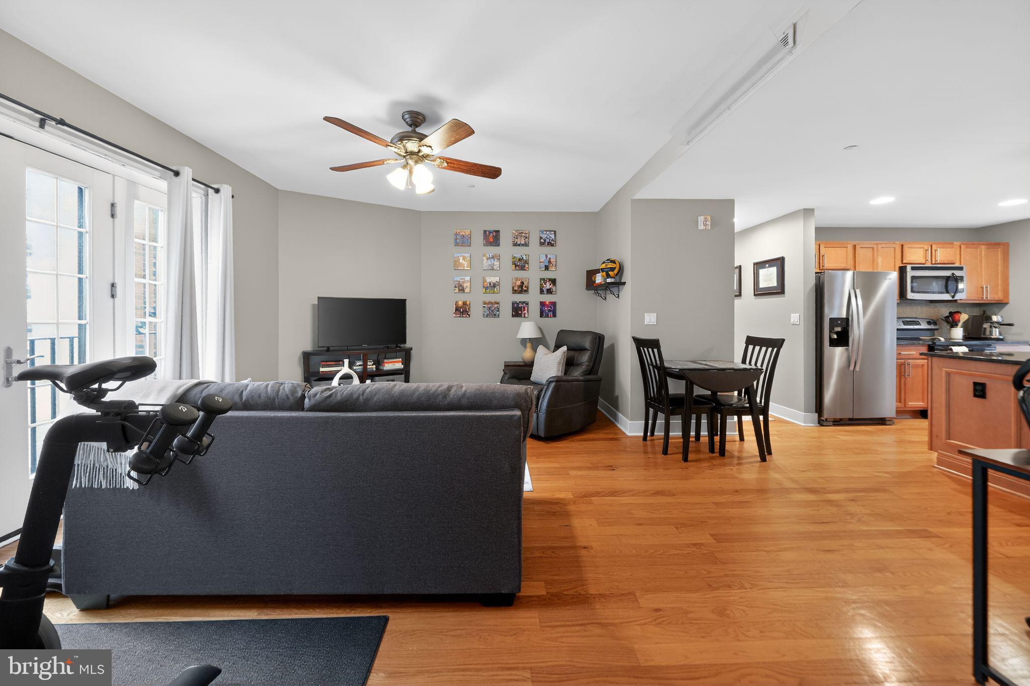 4300 Spruce Street, Unit B304 Philadelphia, PA 19104 - Photo 7 of 26 a living room with furniture and a flat screen tv