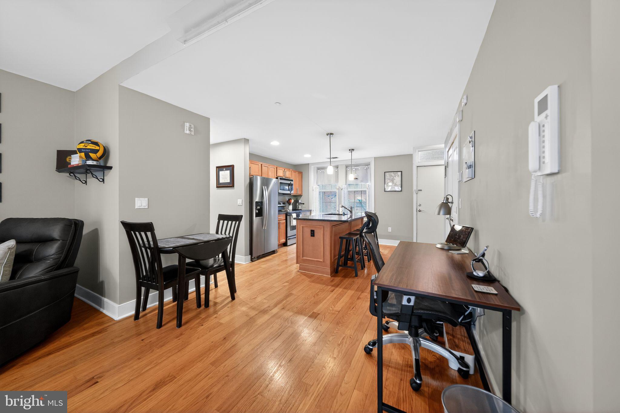 4300 Spruce Street, Unit B304 Philadelphia, PA 19104 - Photo 10 of 26 a living room with lots of furniture and kitchen view