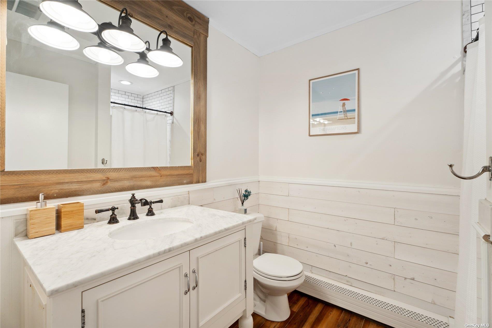 28 Argonne Road West Hampton Bays, NY 11946 - Photo 15 of 24 a bathroom with a sink vanity granite and toilet