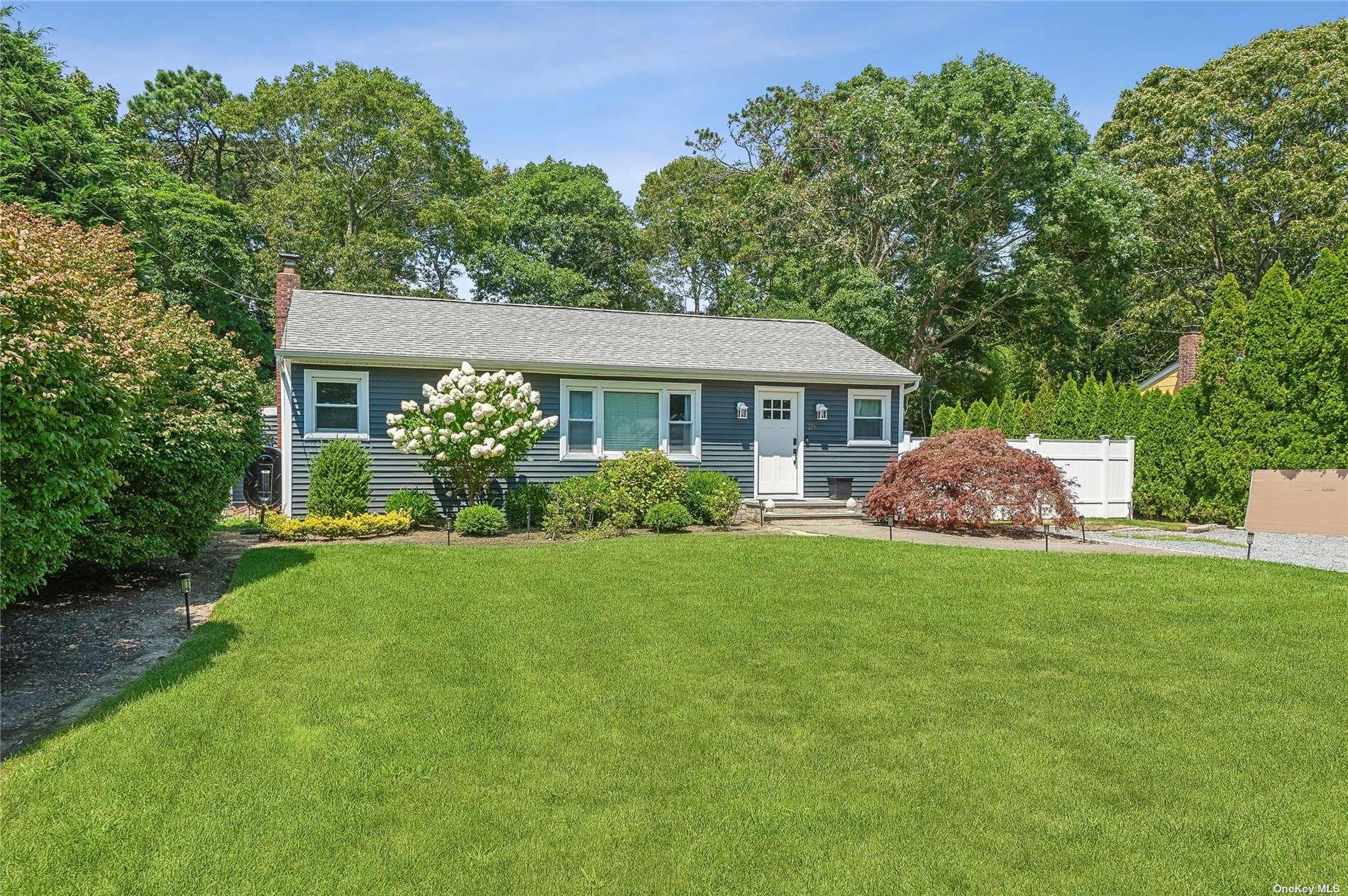 28 Argonne Road West Hampton Bays, NY 11946 - Photo 19 of 24 a front view of a house with a yard