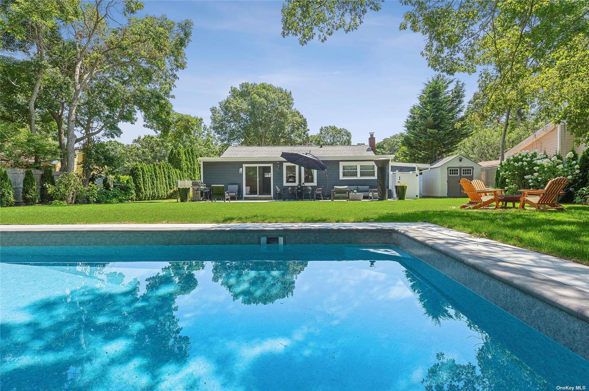 28 Argonne Road West Hampton Bays, NY 11946 - Photo 23 of 24 a view of an house with a swimming pool