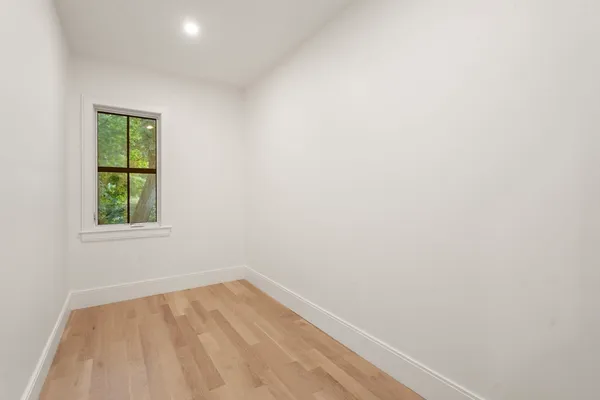 a bathroom with a double vanity sink mirror and shower