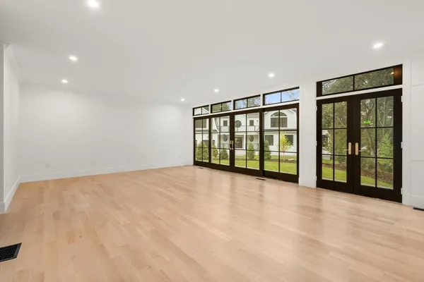 a view of an empty room with glass door