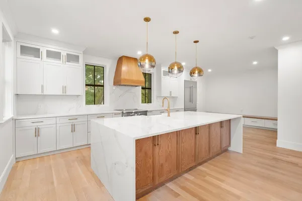 a bathroom with a sink vanity and mirror