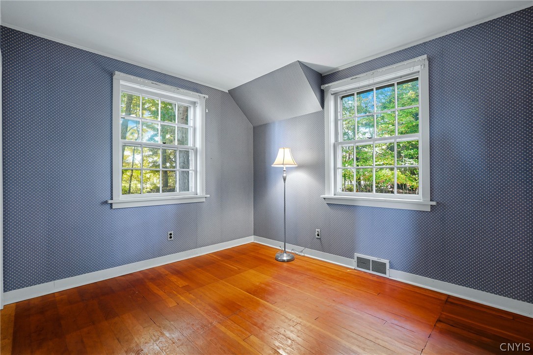 7779 Bell Road North Rome, NY 13440 - Photo 28 of 38 Gleaming hardwood floors run throughout this inviting room framed by multi-pane windows.