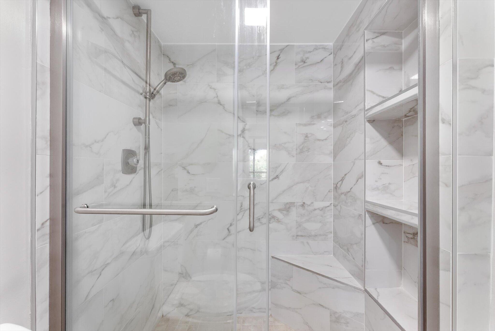 6420 Boca Del Mar Drive, Unit 201 Boca Raton, FL 33433 - Photo 11 of 45 a bathroom with a glass shower door