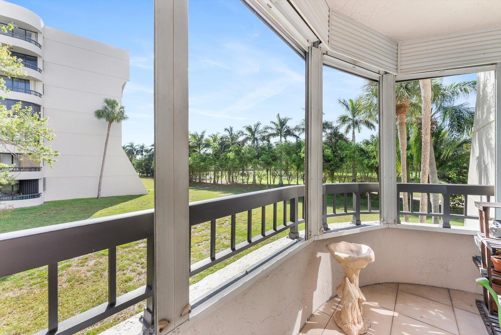 6420 Boca Del Mar Drive, Unit 201 Boca Raton, FL 33433 - Photo 14 of 45 a living room filled with furniture and a large window