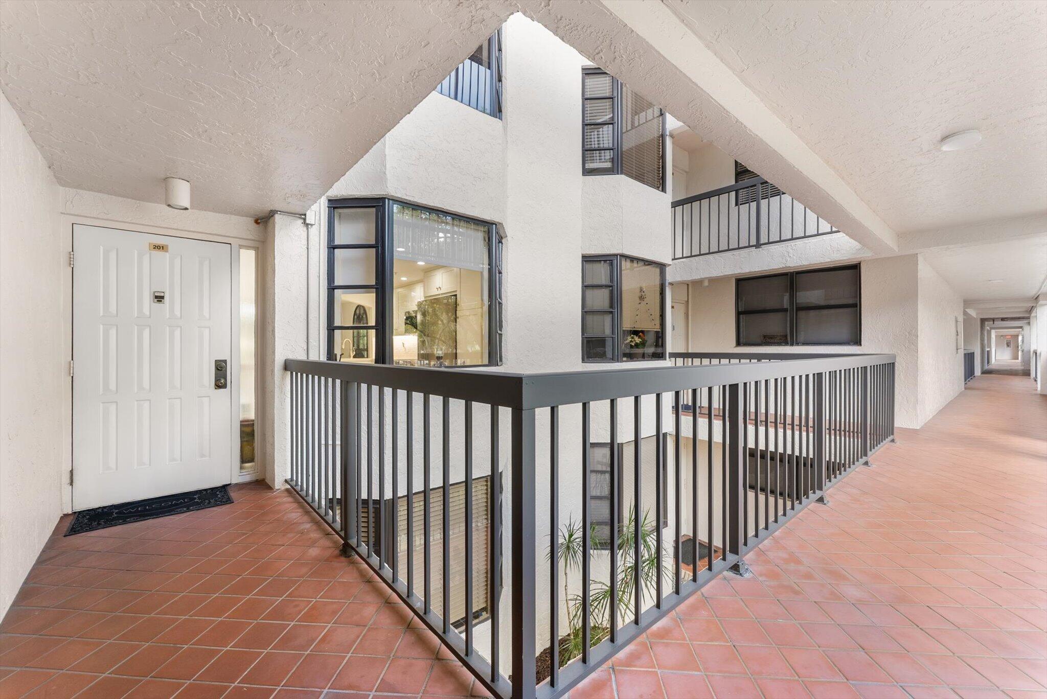 6420 Boca Del Mar Drive, Unit 201 Boca Raton, FL 33433 - Photo 21 of 45 a view of a balcony with furniture and stairs