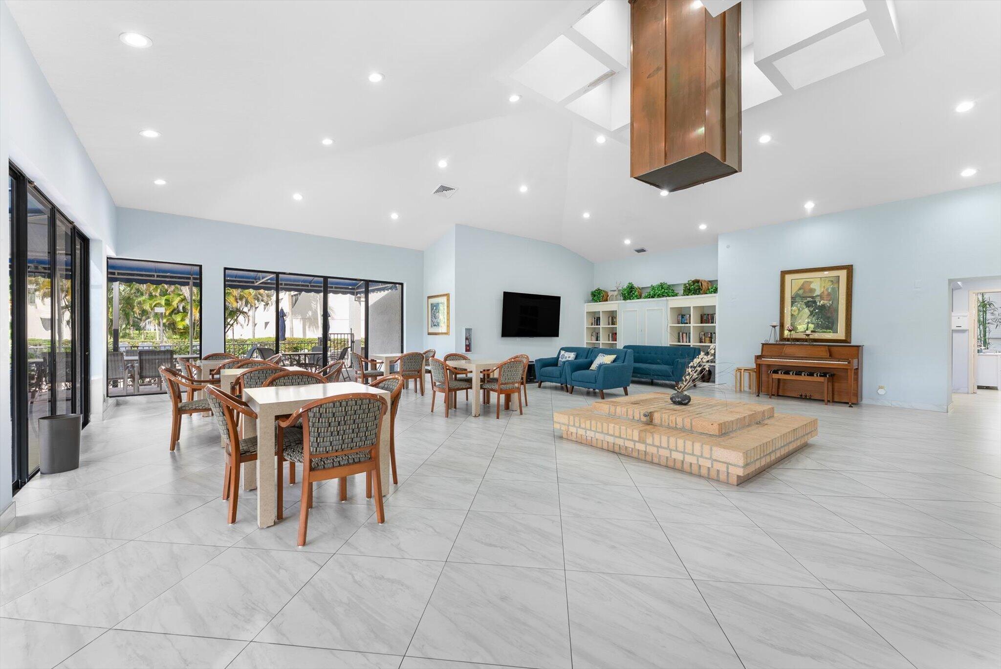 6420 Boca Del Mar Drive, Unit 201 Boca Raton, FL 33433 - Photo 30 of 45 a living room with furniture a dining table and kitchen view