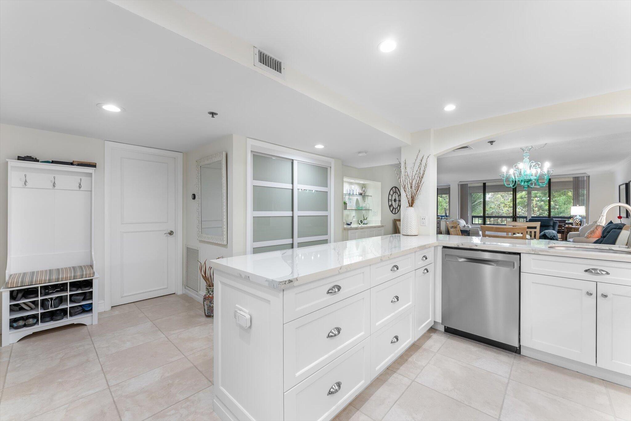 6420 Boca Del Mar Drive, Unit 201 Boca Raton, FL 33433 - Photo 4 of 45 a large white kitchen with a large window