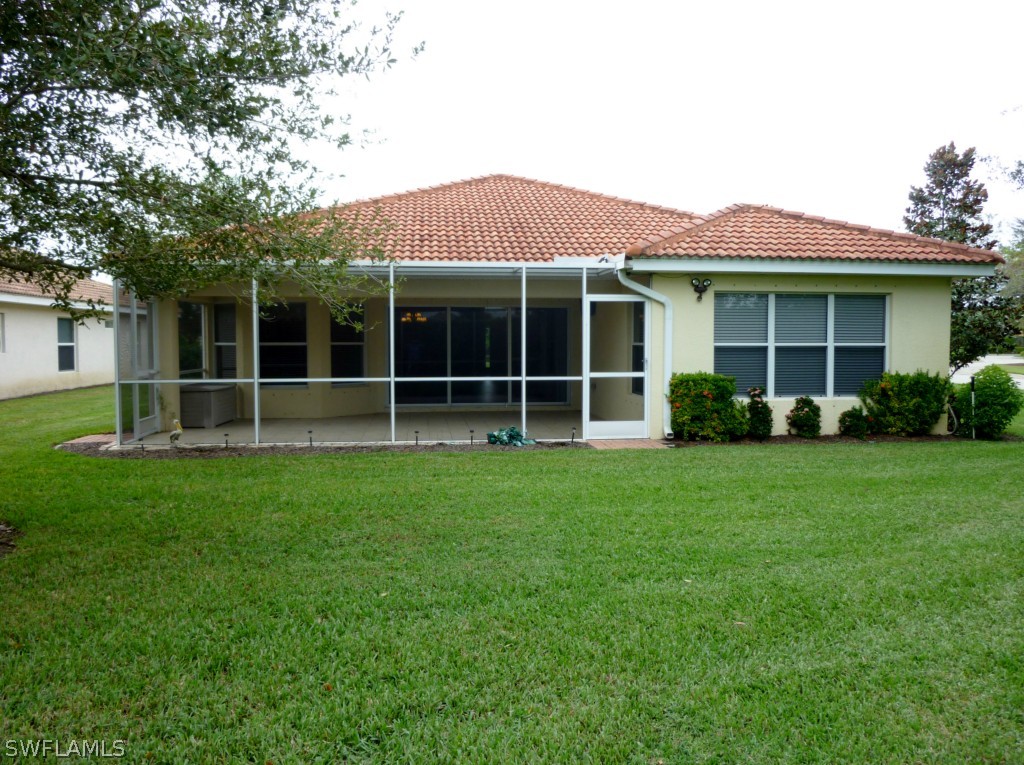 19744 Villa Rosa Loop Fort Myers, FL 33967 - Photo 13 of 14 a view of a house with yard and front view of a house